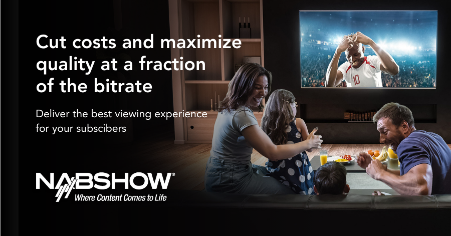 Family watches a sports game on a wall-mounted TV while eating snacks together.